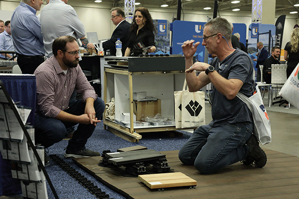 Deck Expo attendee and supplier having a conversation