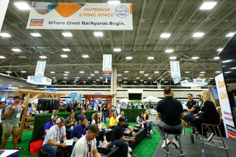 Decking builders and outdoor living pros attending a talk at Deck Expo