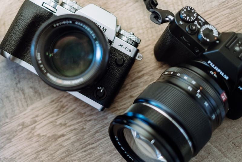 Professional cameras lying on a table