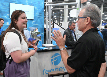 A conversation between an attendee and an exhibitor at International Pool Spa Patio Expo.