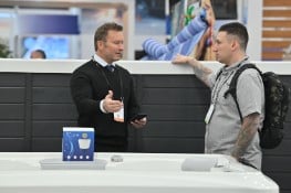 PSP attendees having a discussion at an exhibitor's booth