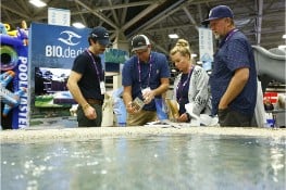 PSP Expo attendees looking at a pool on the show room floor